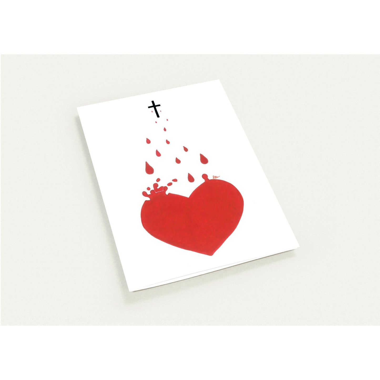 Card with a red heart and cross design on a white background