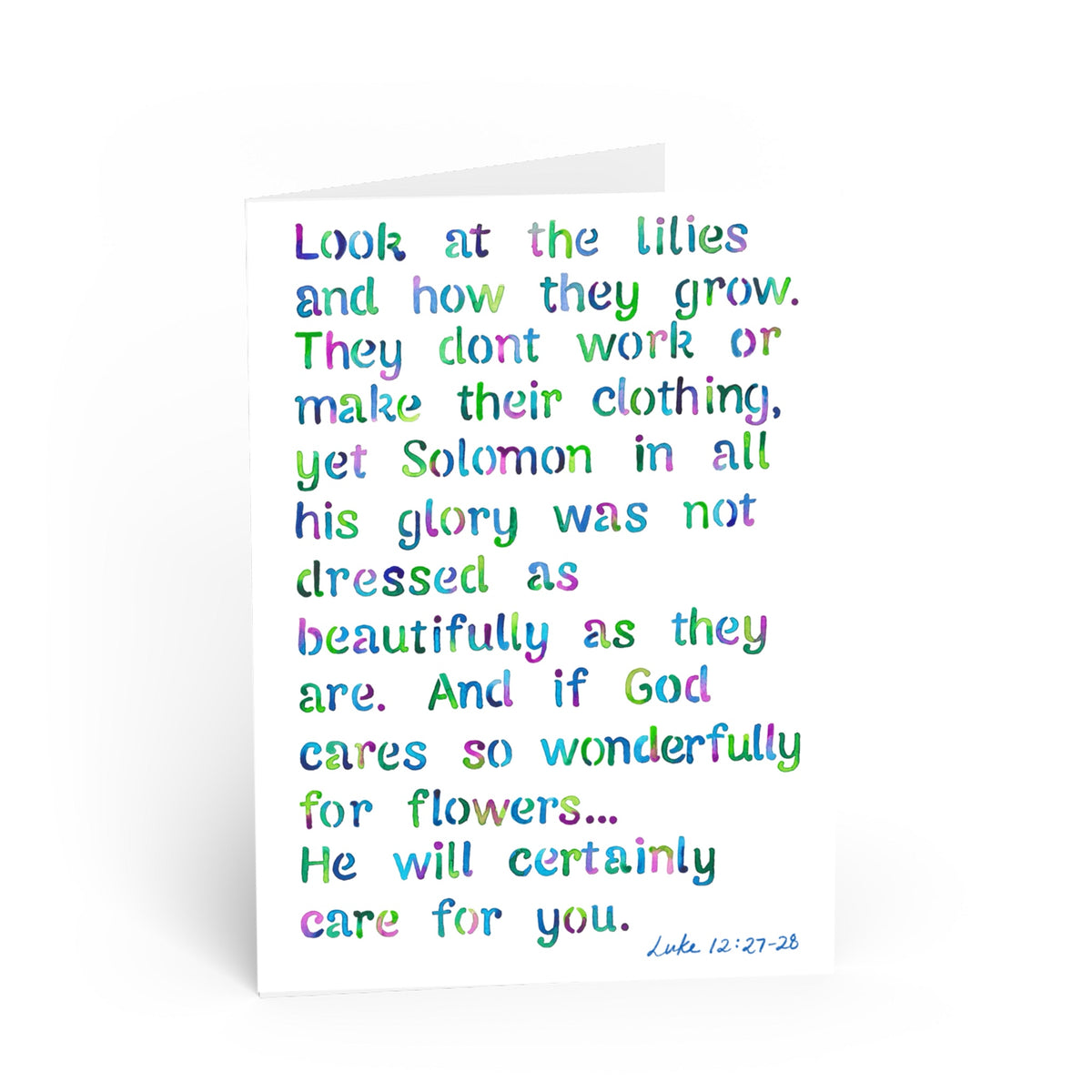 A white greeting card with a colorful, hand-lettered Bible verse from Luke 12:27-28 in pastel rainbow colors, shown on a clean white background.