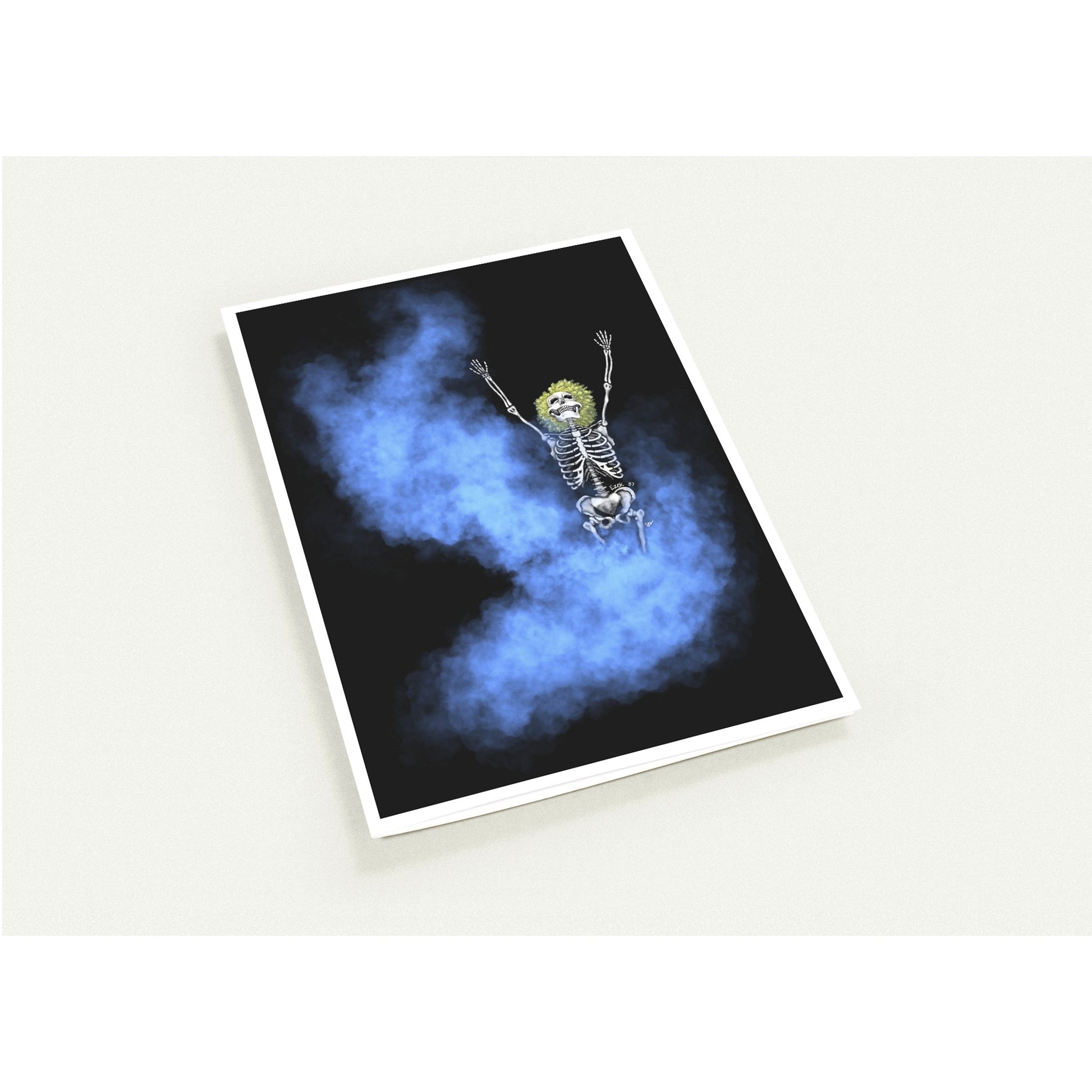 A rectangular art card with a white border, shown at an angle on a light beige background. The artwork features a cartoon skeleton with raised arms floating or falling through swirling blue smoke on a black background.